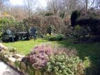 Garden - Secluded South facing with garden furniture and B-B-Q. Lawn/flower beds, herb bed and shallow stream at end of garden
